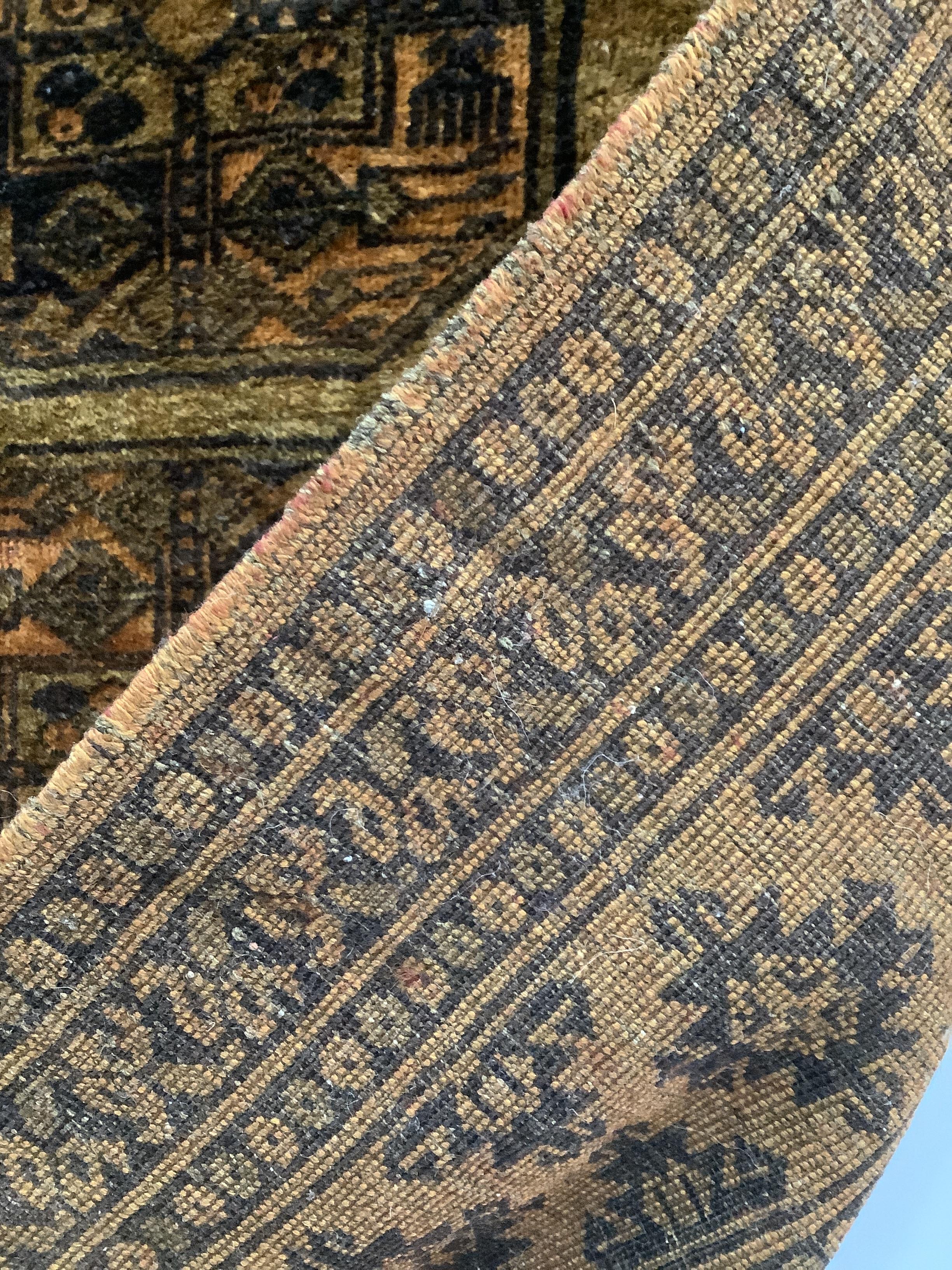 An Afghan gold ground rug, 196 x 125cm